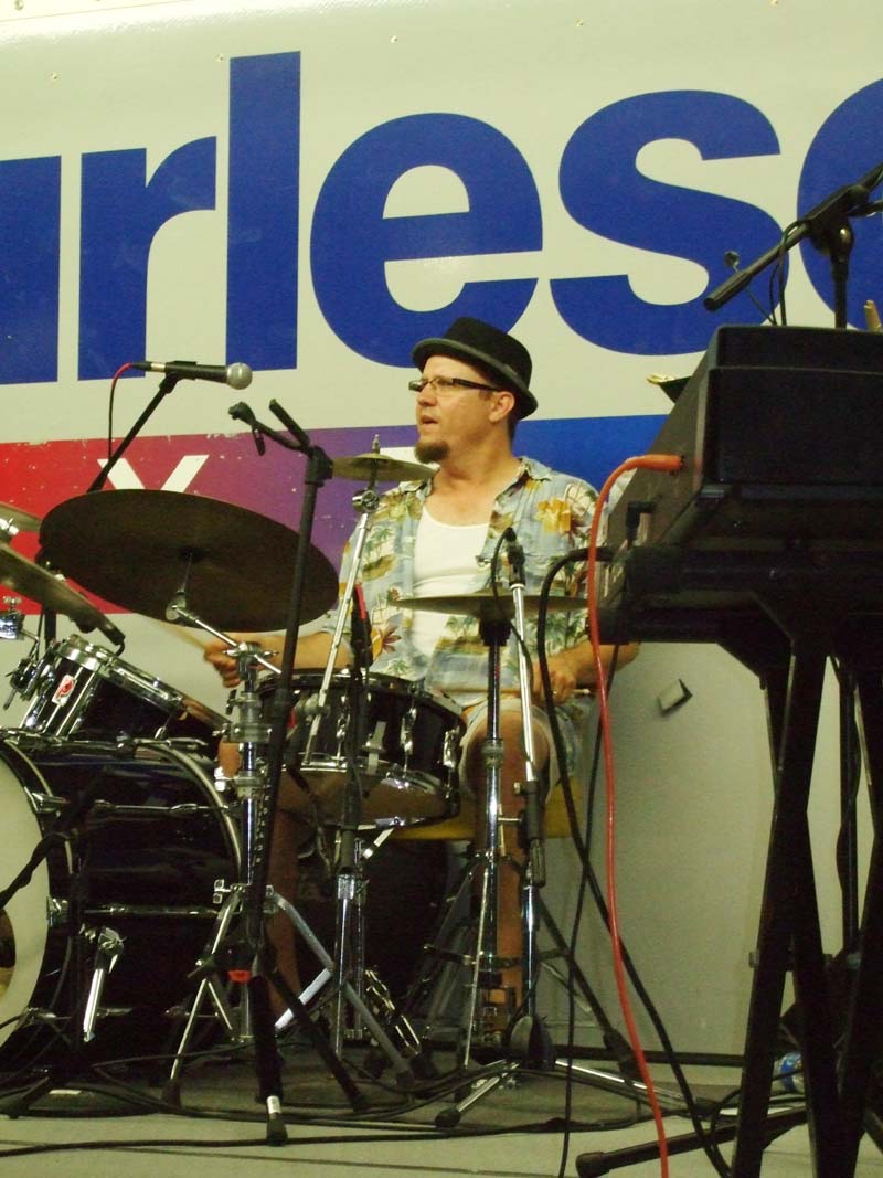 Photo of band member playing drums
